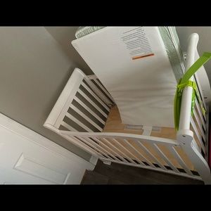 Gentle use white mini crib